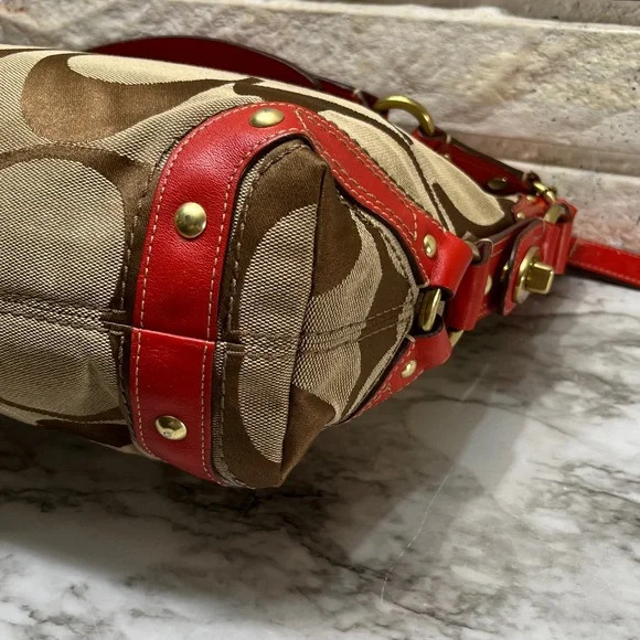 Coach Carly Signature Hobo Bag with red leather trim and gold-tone hardware. - Picture 10 of 14